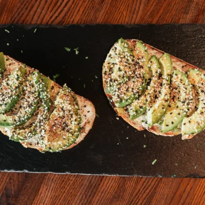 Avocado toast with everything seasoning served on artisan bread at Bistro 1969