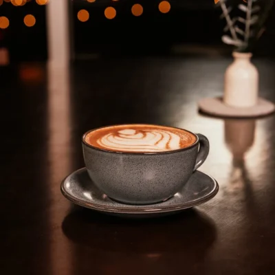 Cappuccino with latte art served on a table at Bistro 1969 café