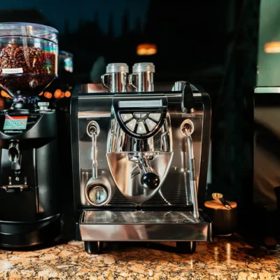 Professional espresso coffee machine and grinder setup at Bistro 1969 café