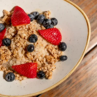 Granola breakfast bowl with fresh strawberries and blueberries served at Bistro 1969