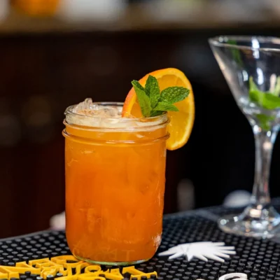 Fresh orange cocktail with mint garnish served at Bistro 1969 bar